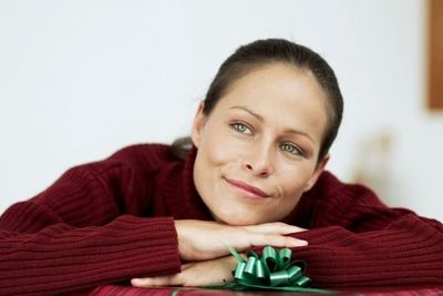 woman leaning on a gift