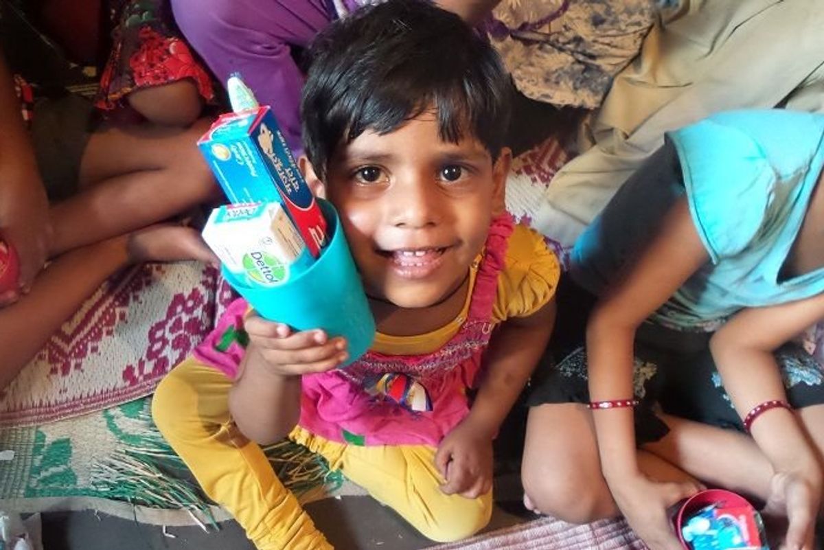 indian girl holding toiletries