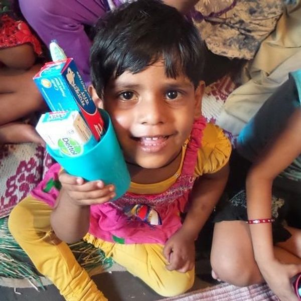 indian girl holding toiletries