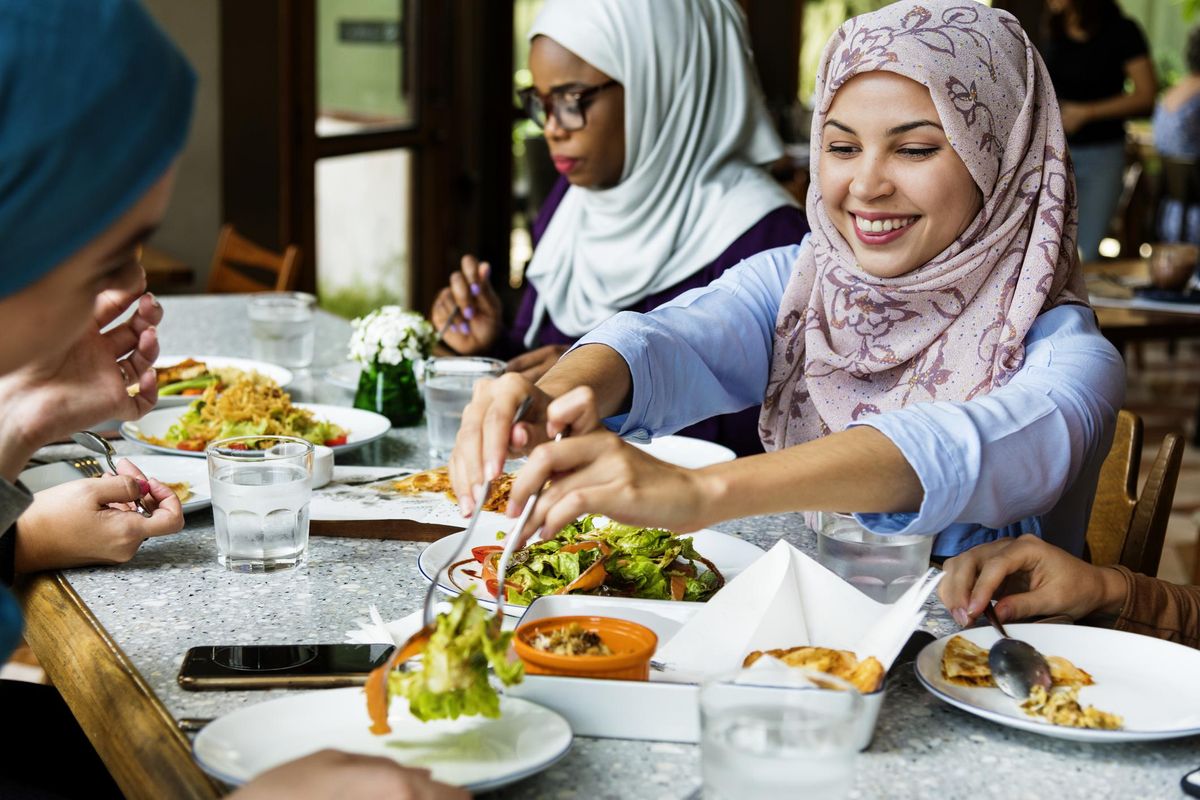 Islamic women friends dining together