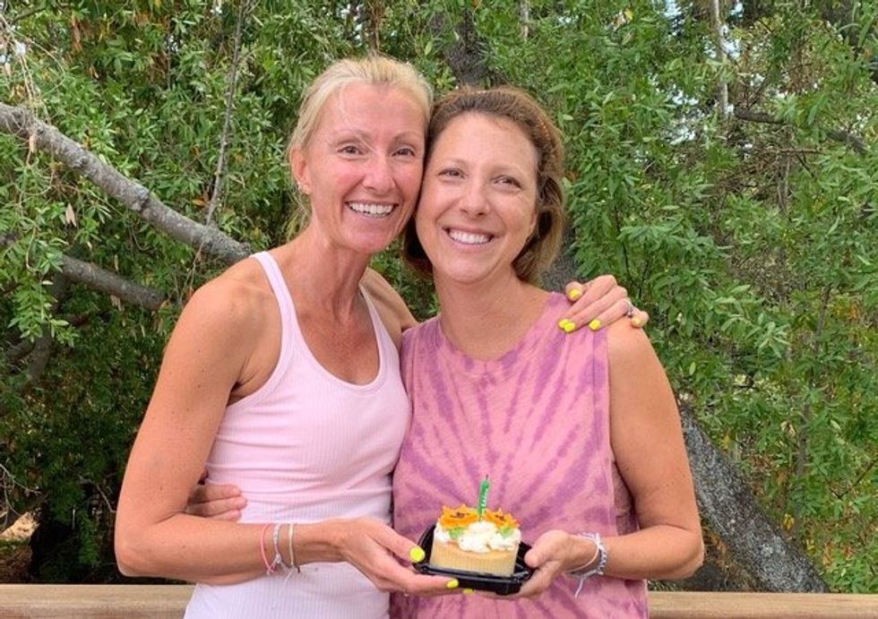 Jacque and a friend celebrating her first post-treatment birthday