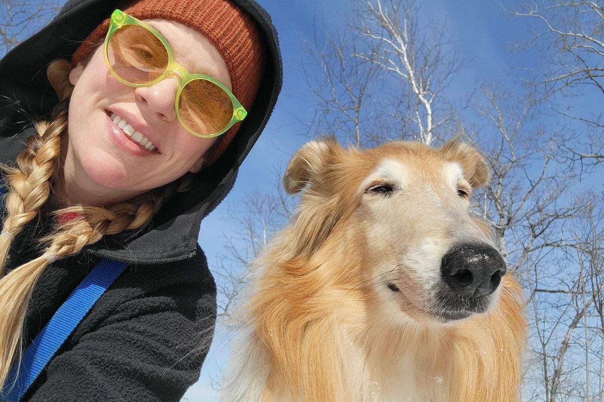 Katie and her dog, Moxie, on a hike near their home earlier this year.