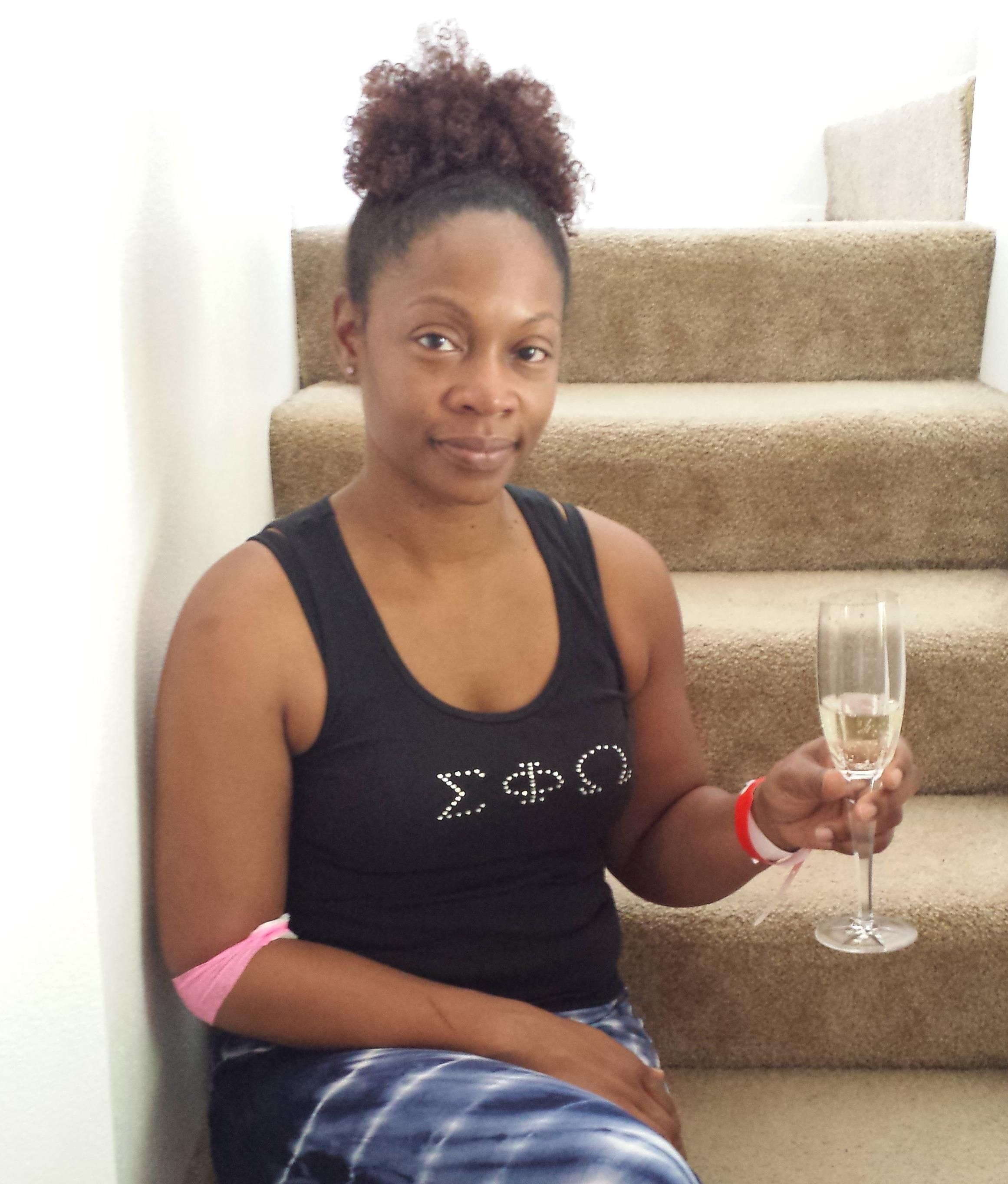 Kimberly with her champagne, celebrating u201ckicking canceru2019s buttu201d after her diagnosis, July 24, 2015.
