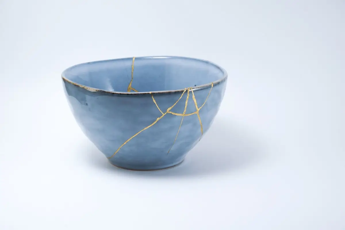 Kintsugi blue bowl repaired with gold