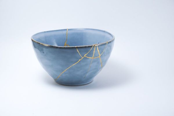 Kintsugi blue bowl repaired with gold