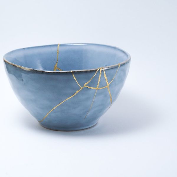Kintsugi blue bowl repaired with gold