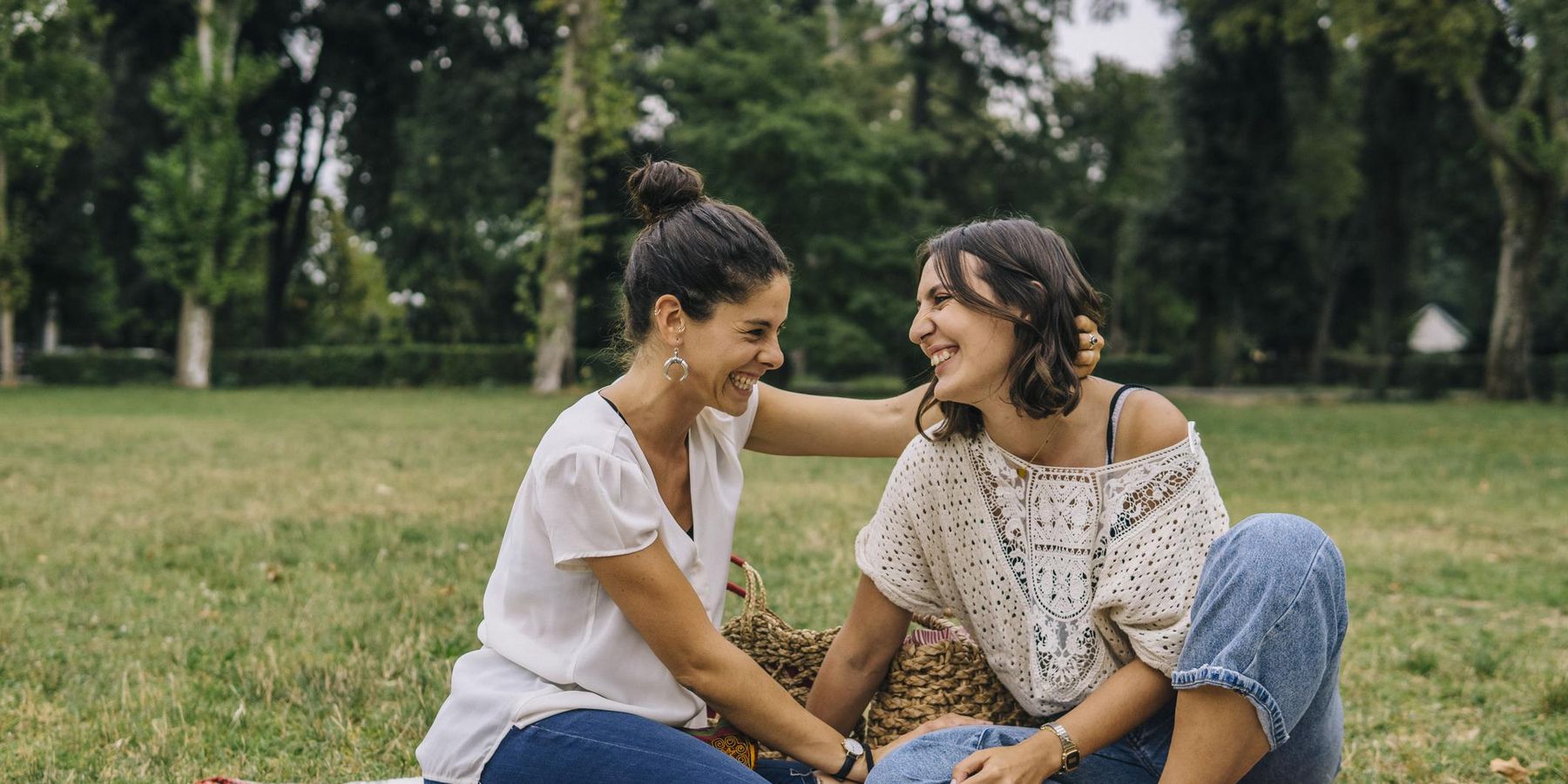 Lesbian couple relaxing outdoors in a park