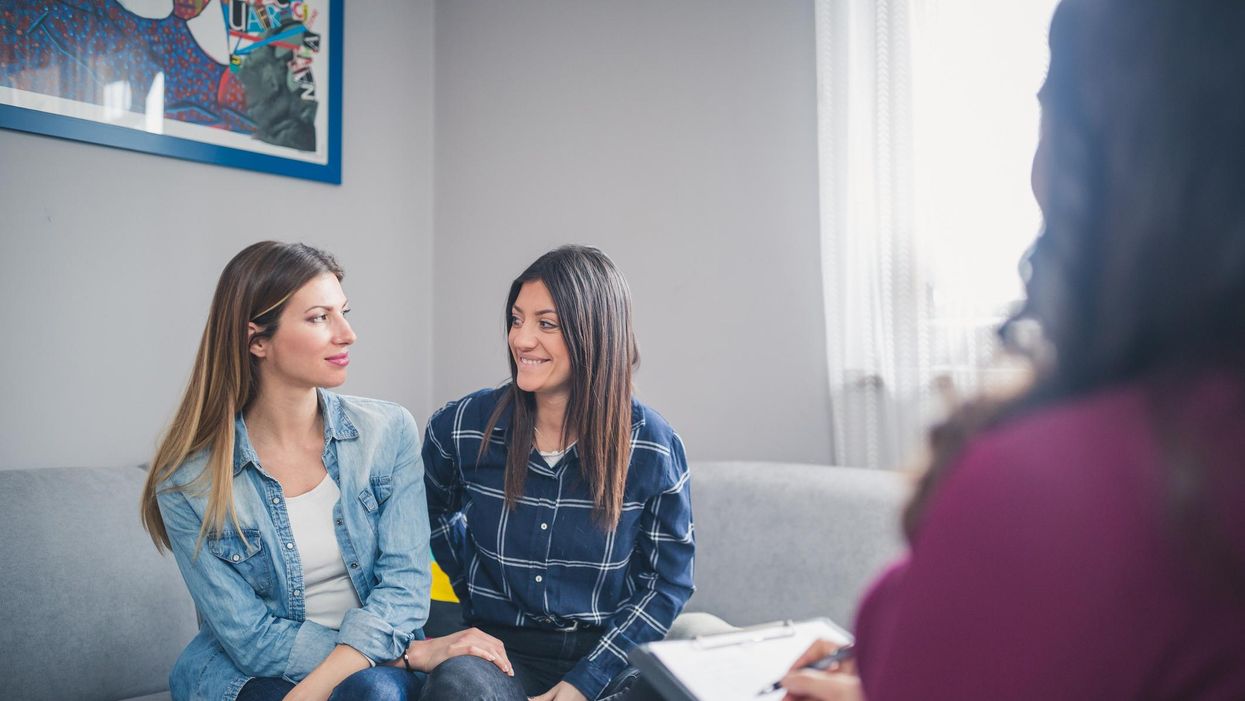 Lesbian couple Sitting in the living room with a sex therapist