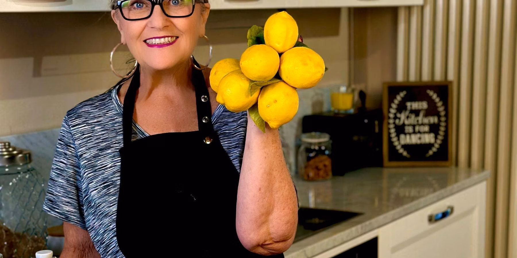Linda holding lemons