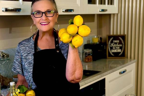 Linda holding lemons