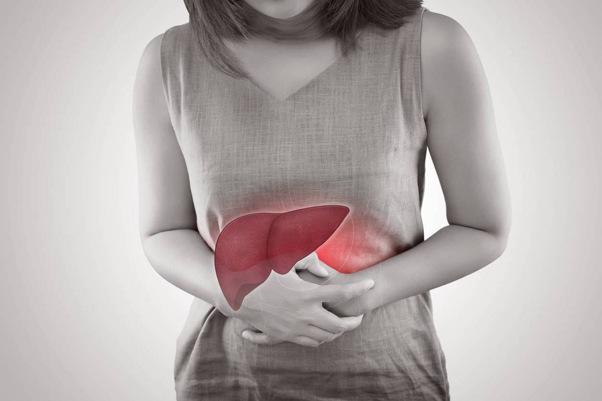 Liver On Woman's Body Against Gray Background