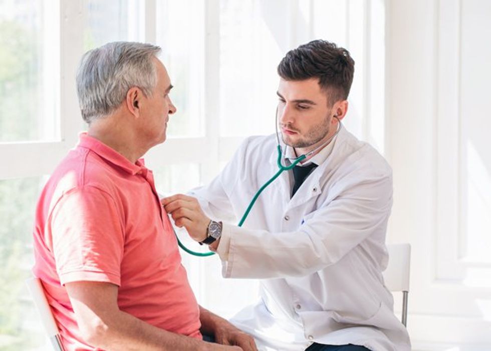 man being examined by doctor