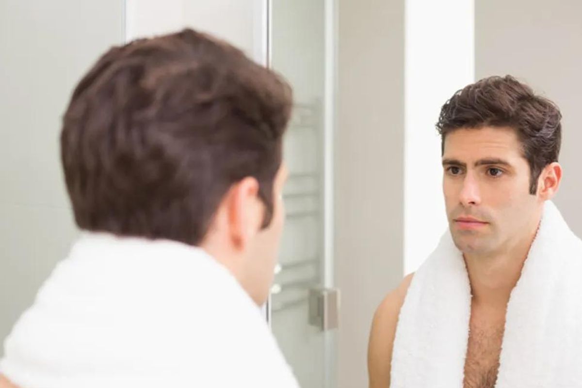 man looking in the mirror
