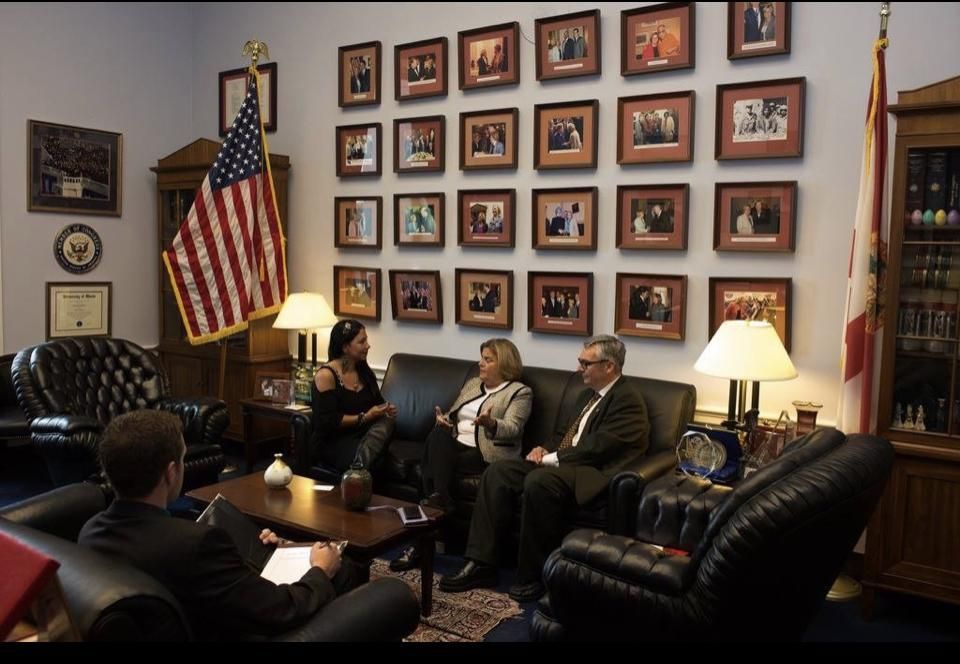 Maria Mejia speaks with members of Congress