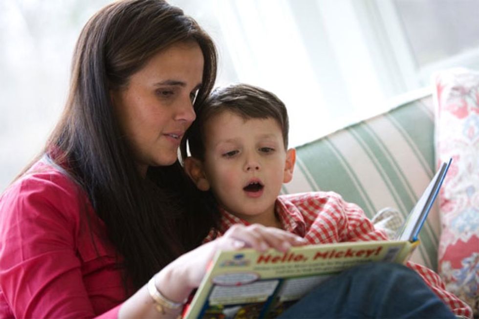 Mary Joe and her son reading