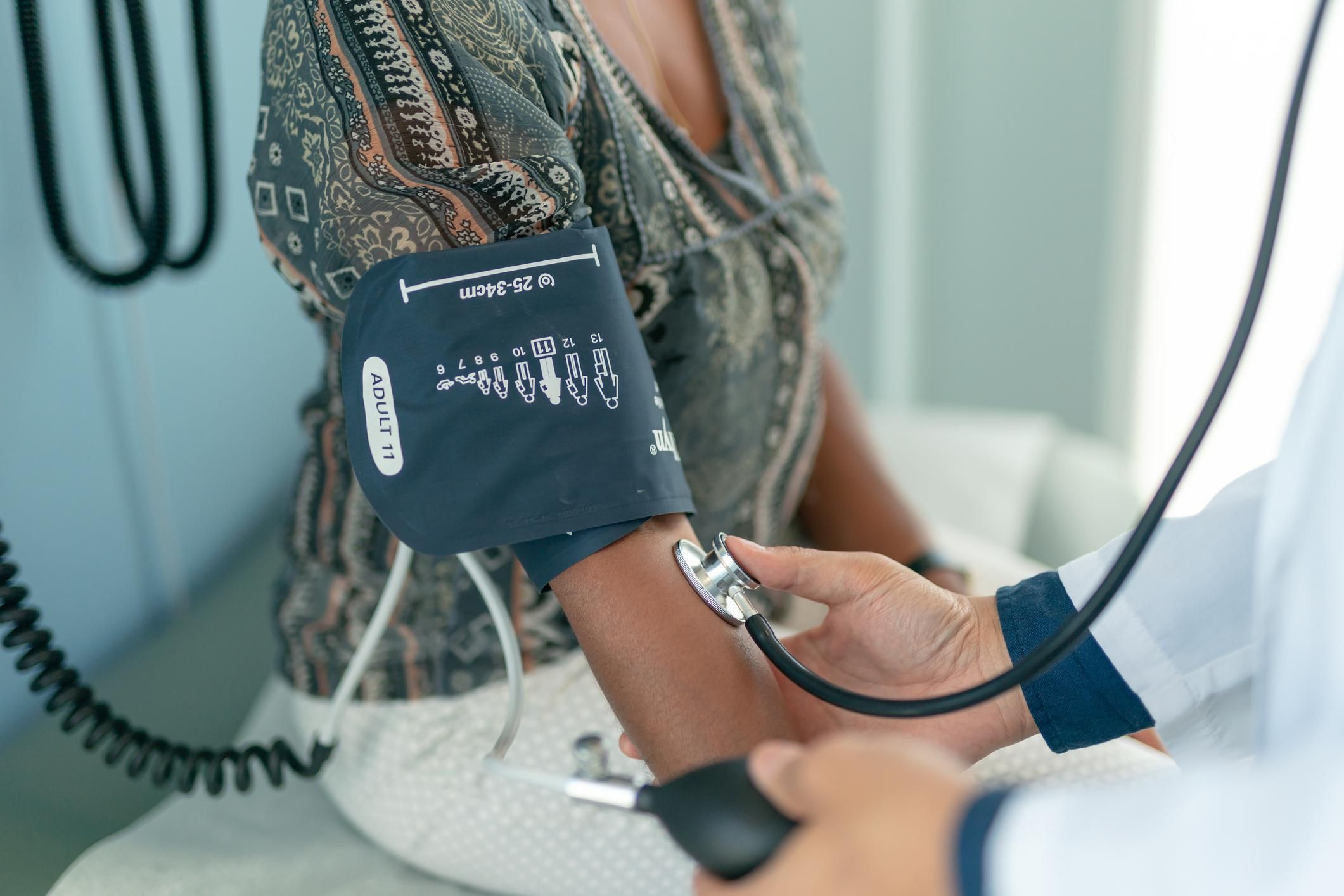 Mature adult woman has blood pressure