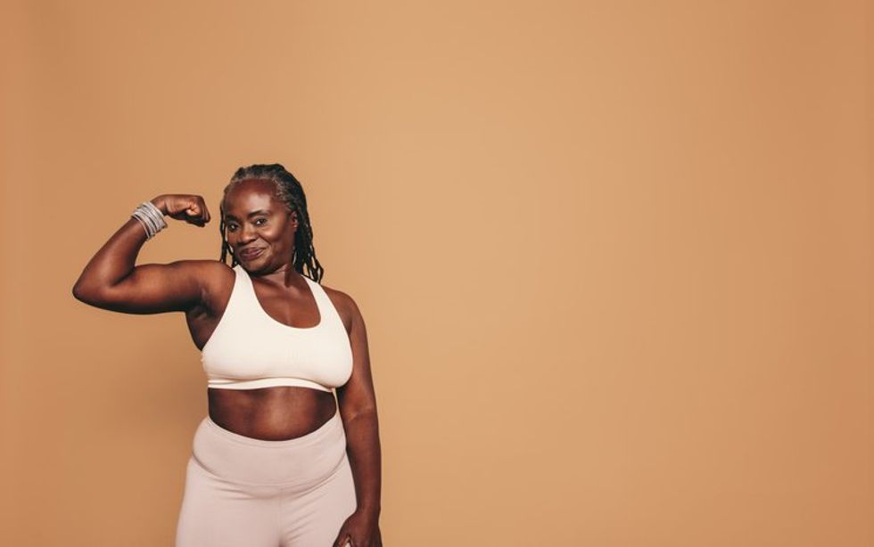 Mature woman flexing her bicep