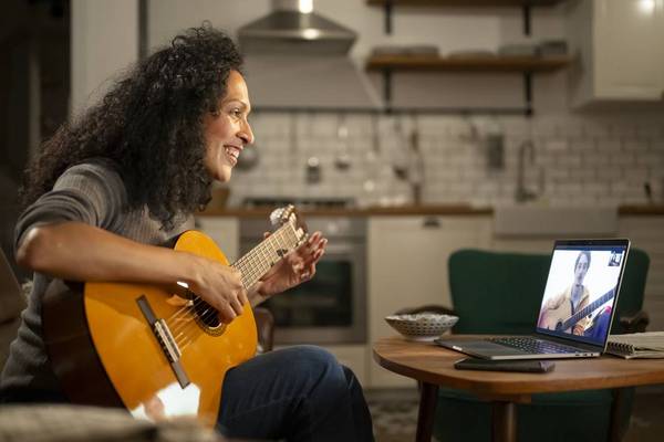 Mature woman playing guitar
