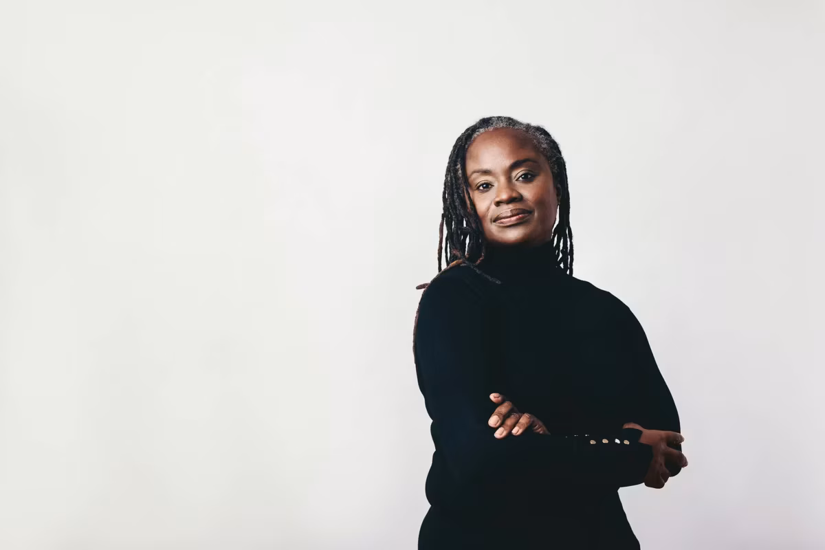 Mature woman with dreadlocks looking at the camera