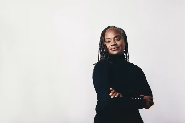Mature woman with dreadlocks looking at the camera