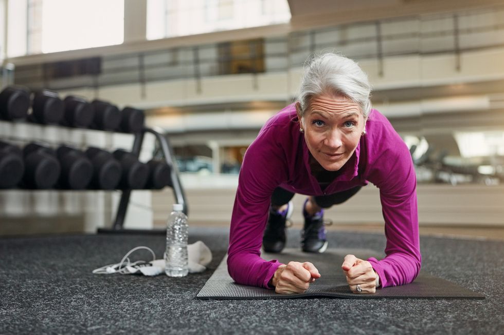 mature woman working out at the gym