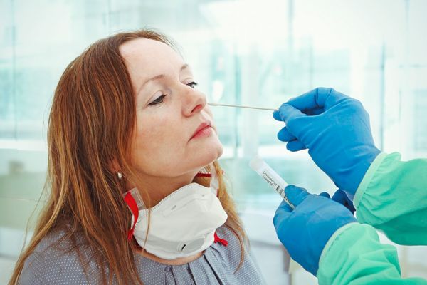 Medic taking sample from patients nose for coronavirus testing