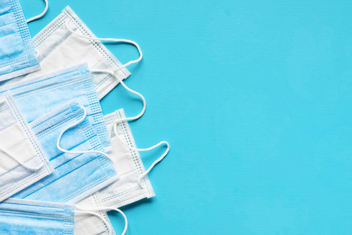 Medical face masks on blue background