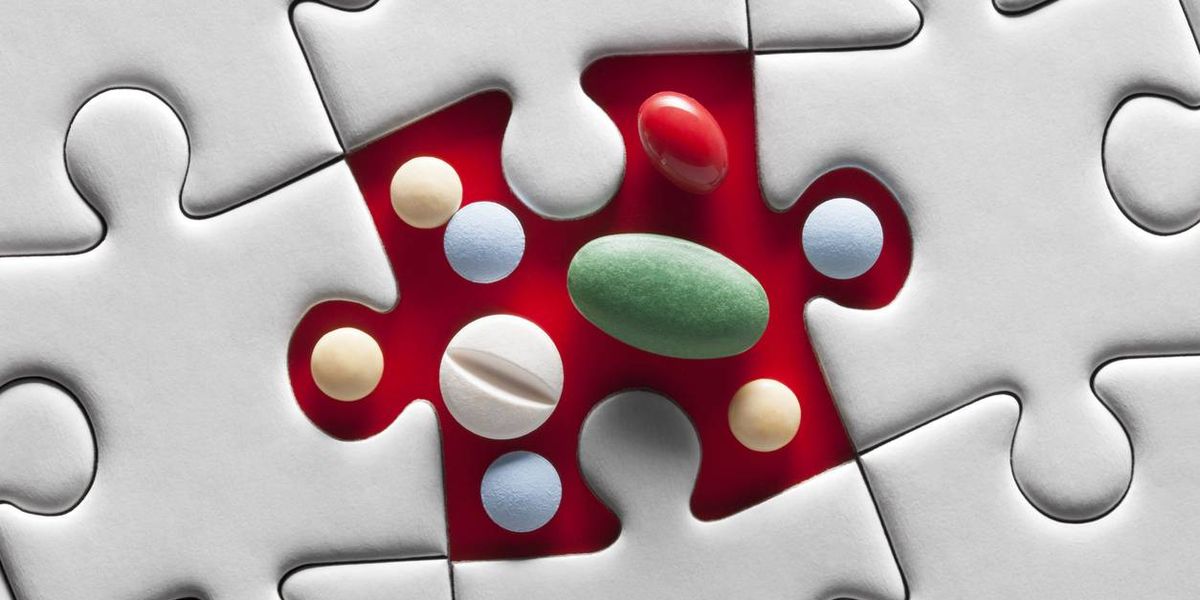Medical pills on puzzle piece.
