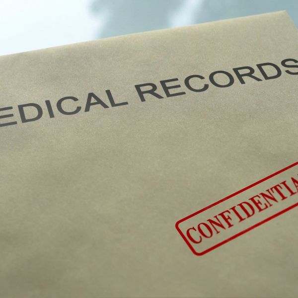 Medical records confidential, seal stamped on folder with important documents
