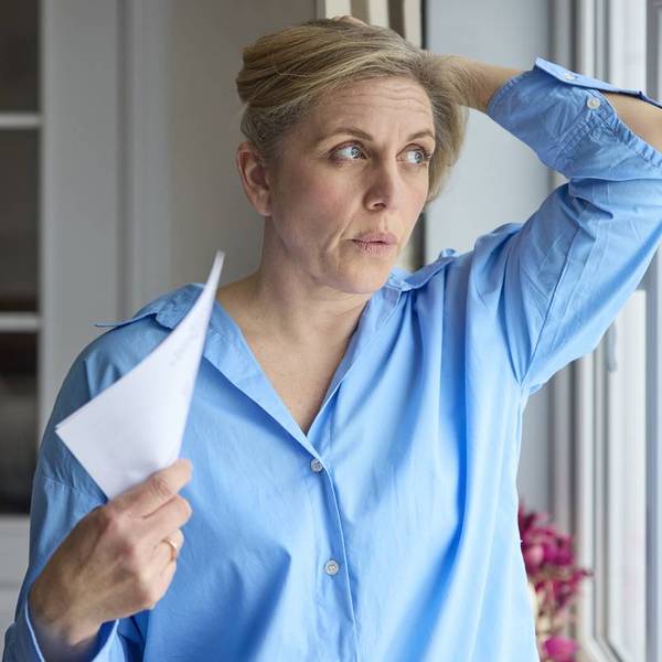 Menopausal Mature Woman Having Hot Flash At Home