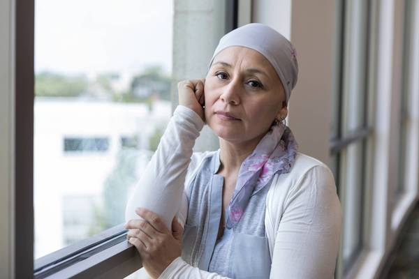Mid adult woman fighting cancer