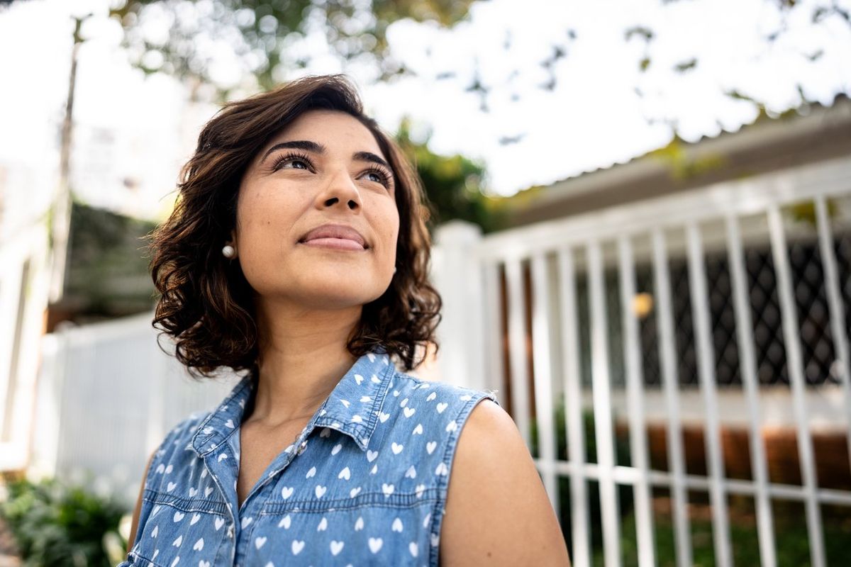 Mid adult woman with schizophrenia contemplating