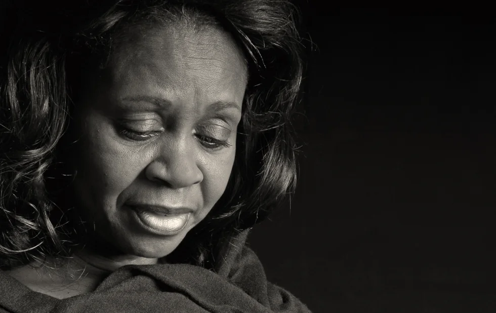 Middle-aged beautiful African american woman looking thoughtful