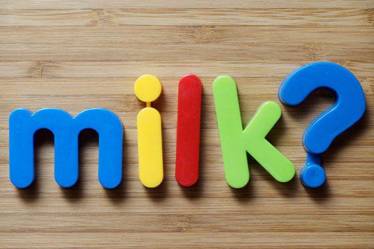 milk spelled out in kids letter magnets