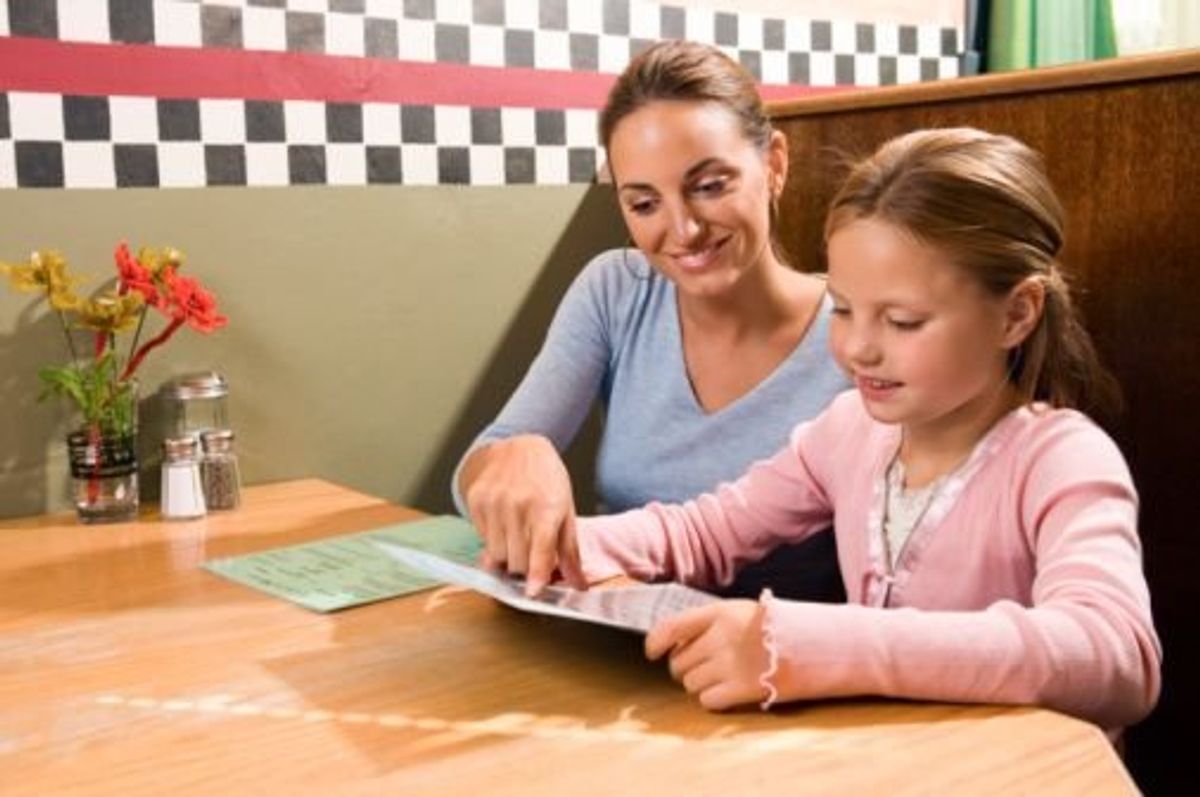 mom and child eating at a restaurant