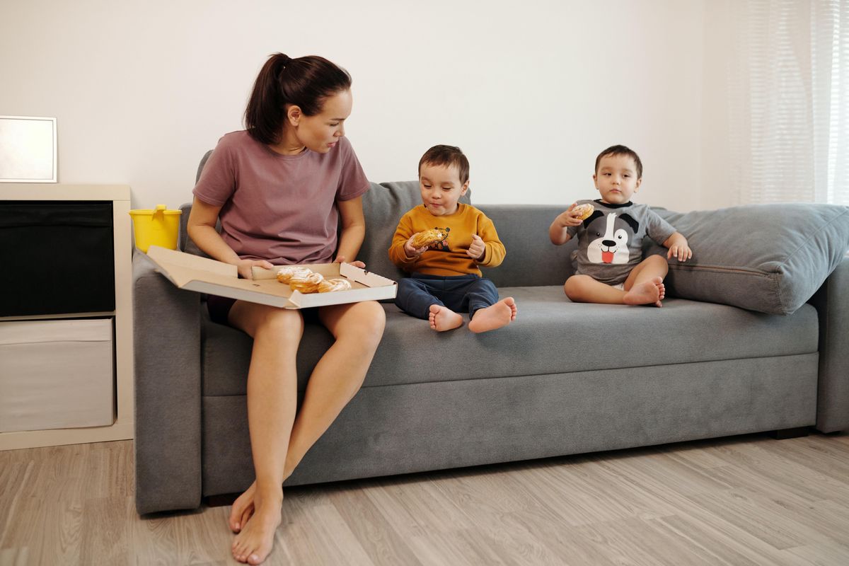 mom sitting on the couch with twins