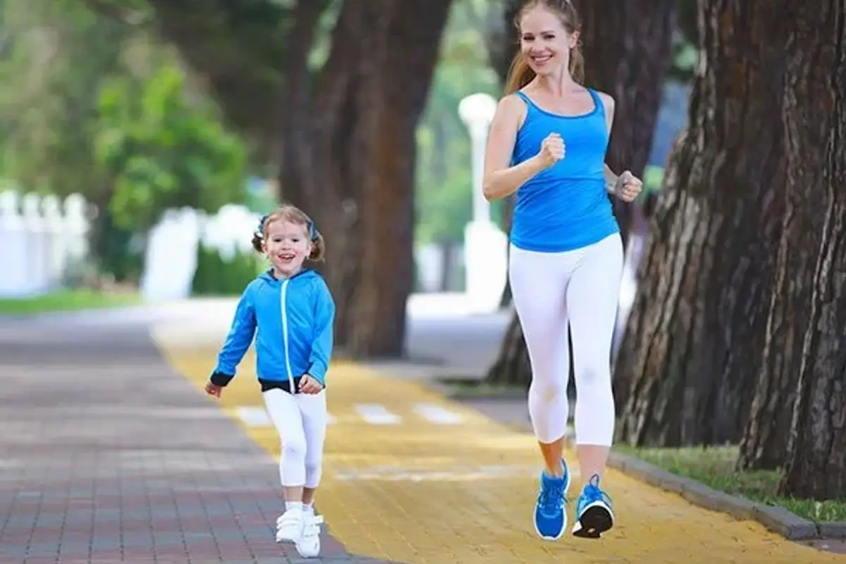 Mother and baby daughter jogging