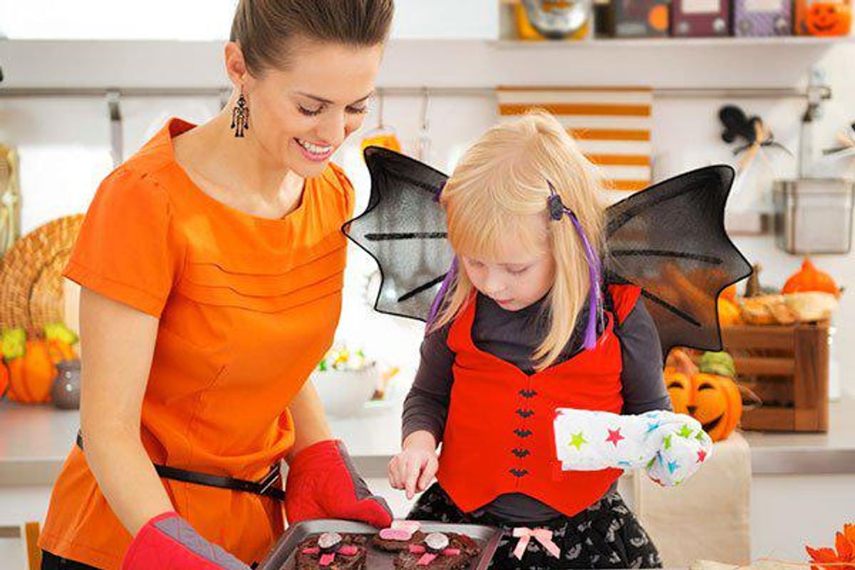 mother and daughter making halloween treats