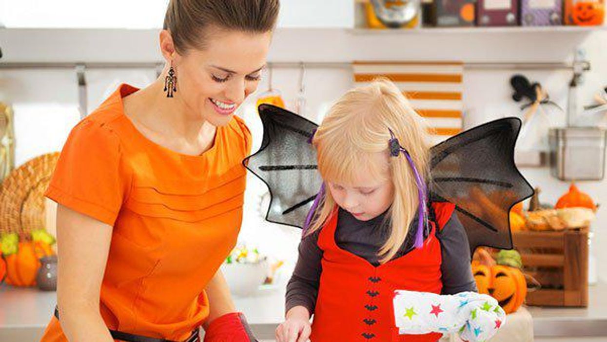 mother and daughter making halloween treats