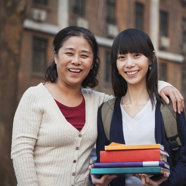 Mother and daughter portrait in front of dormitory