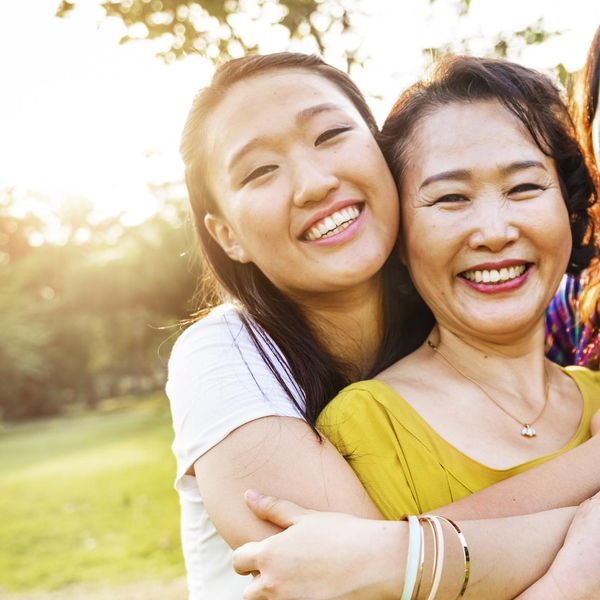 mother and daughters hugging