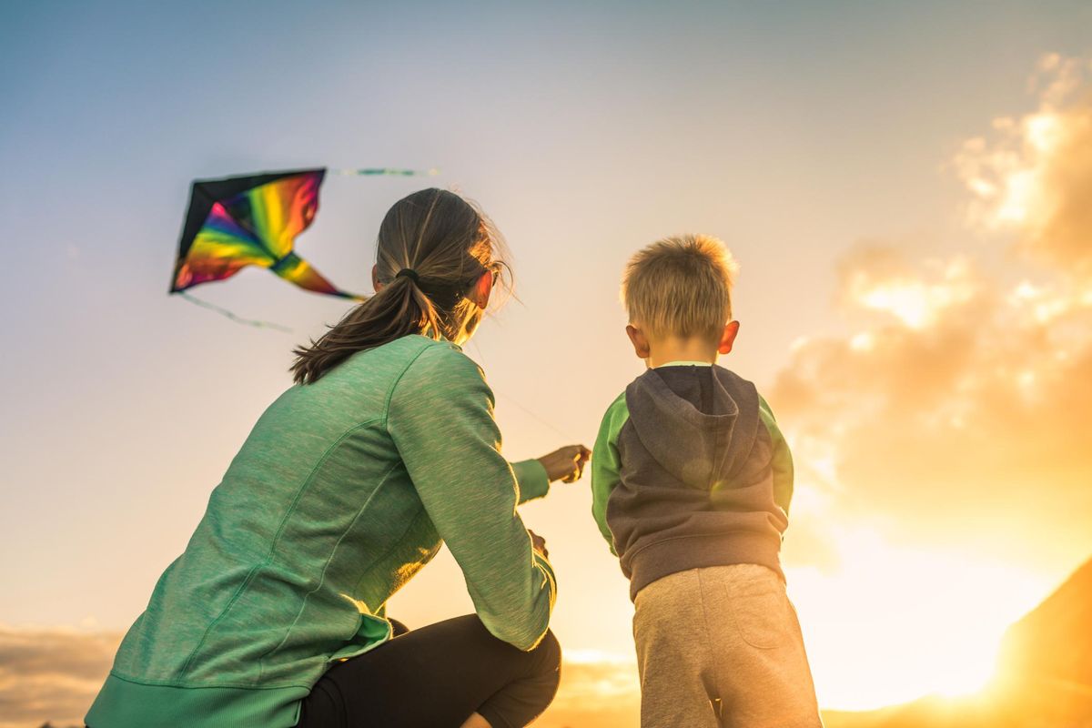 Mother and son flying a kite