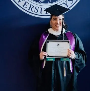 Natalie Chambers receiving her MA in law, 2022. 