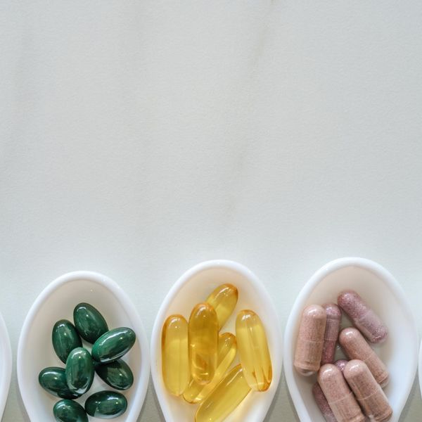 natural vitamin supplement on white spoon