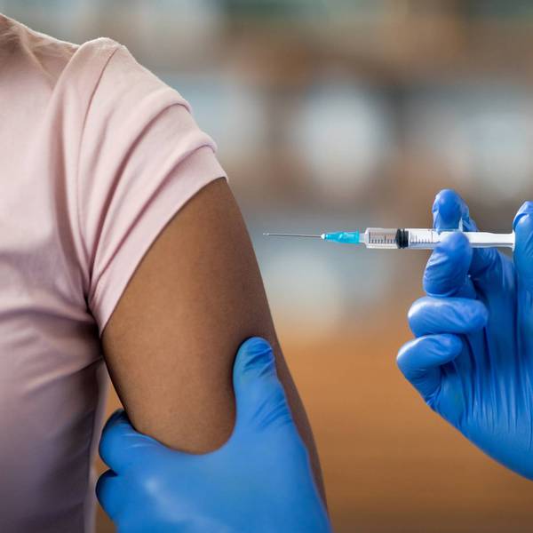 Nurse giving Biologics injection to woman patient for Treating Asthma