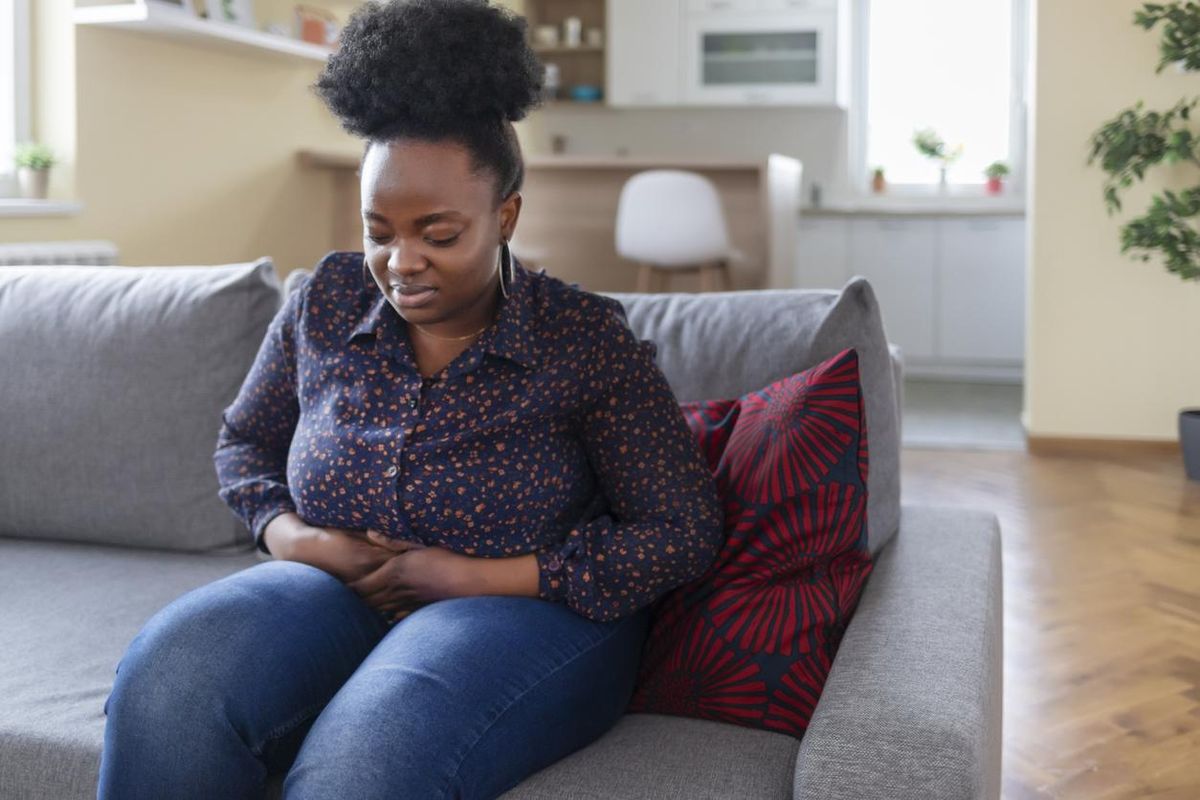 Obese African American Woman Suffering From Strong Abdominal Pain