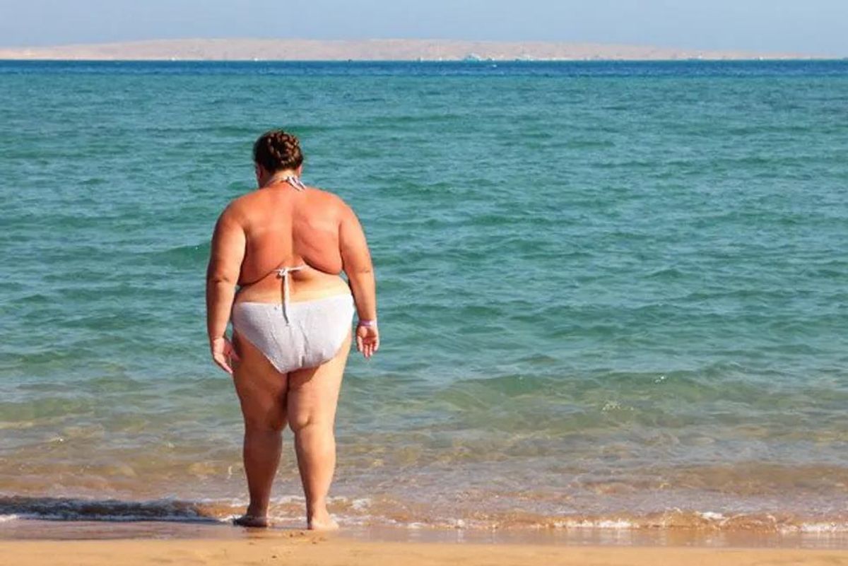 obese woman on the beach