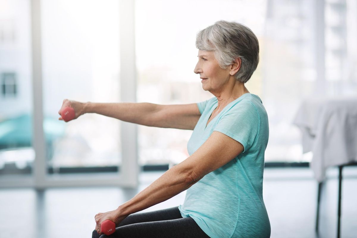 older woman lifting weights