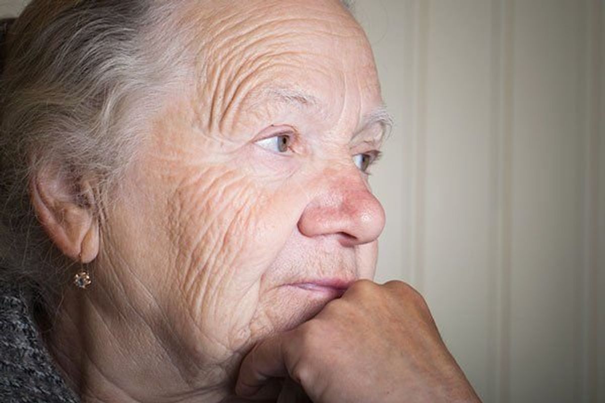 older woman looking pensive