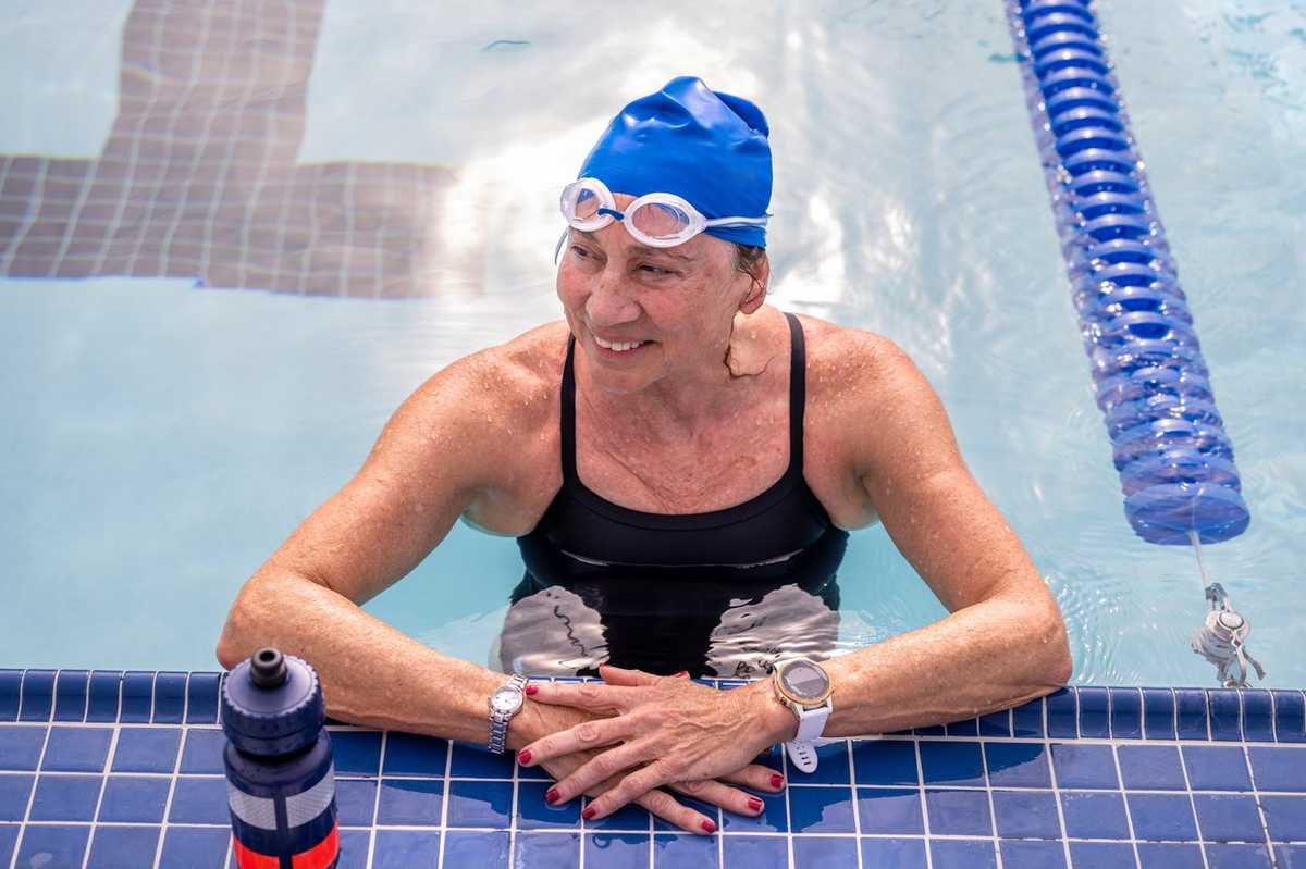 older woman swimming in a pool